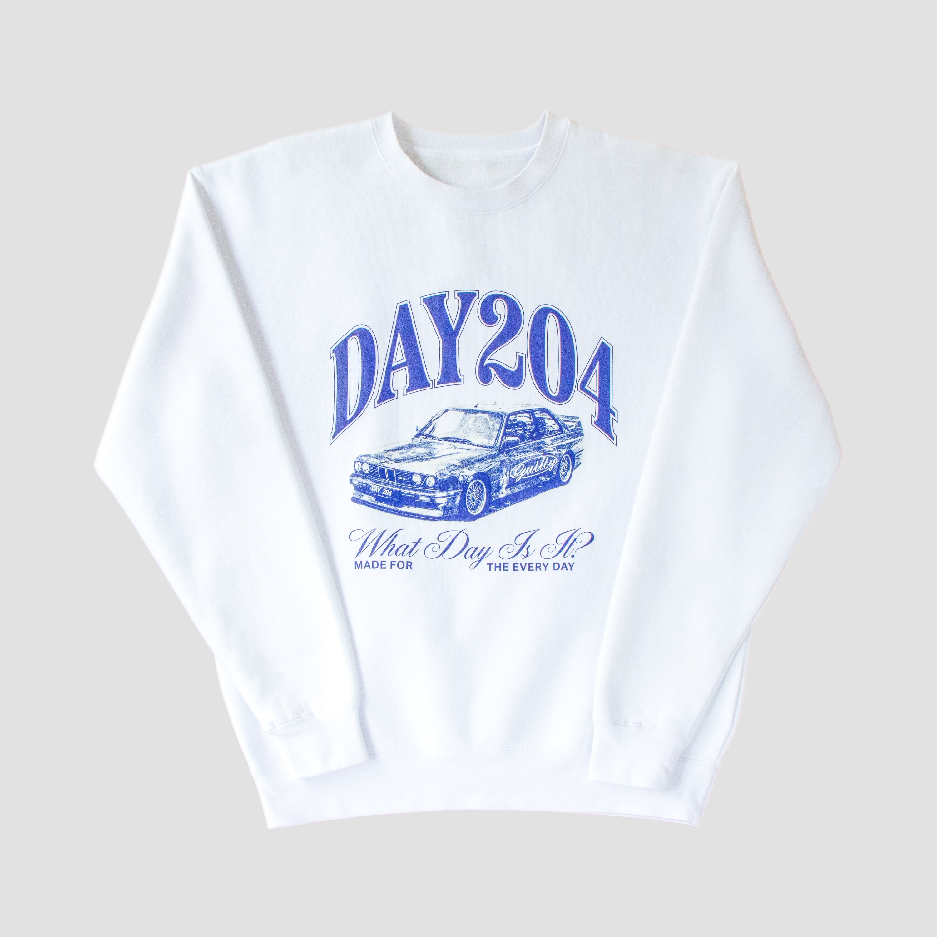 White sweatshirt with blue graphic design on a light gray background